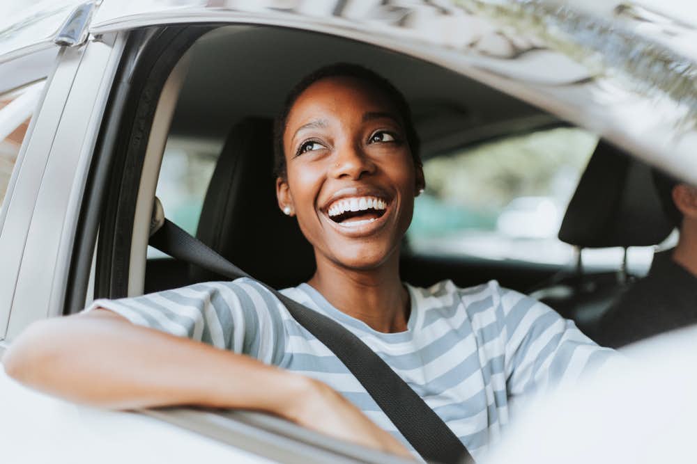 Cheerful woman in a car