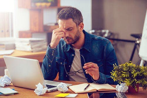 man looking very frustrated with his broadband connection
