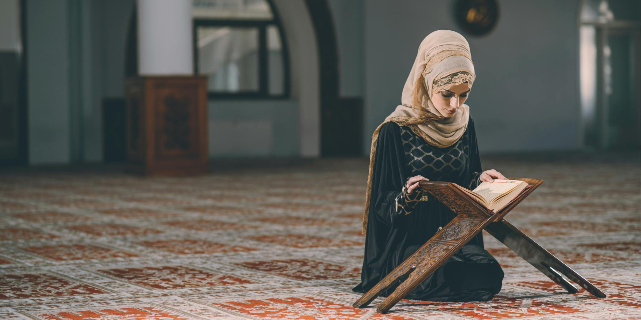 Muslim woman reading book