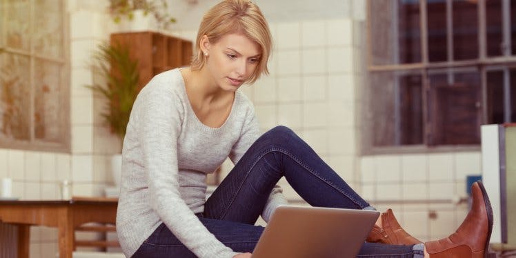 girl-on-laptop-in-her-flat