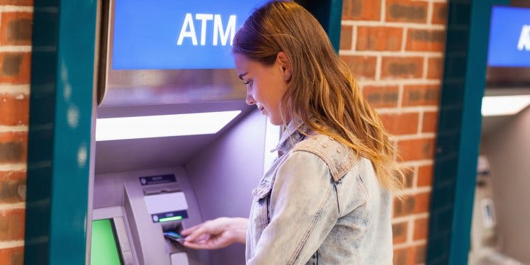woman-using-cash-machine