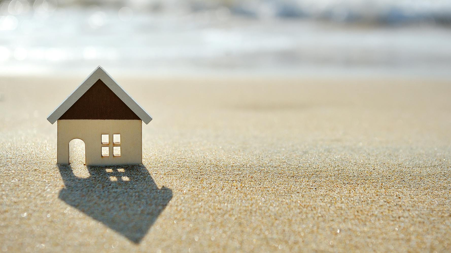 little house on the sand beach near sea
