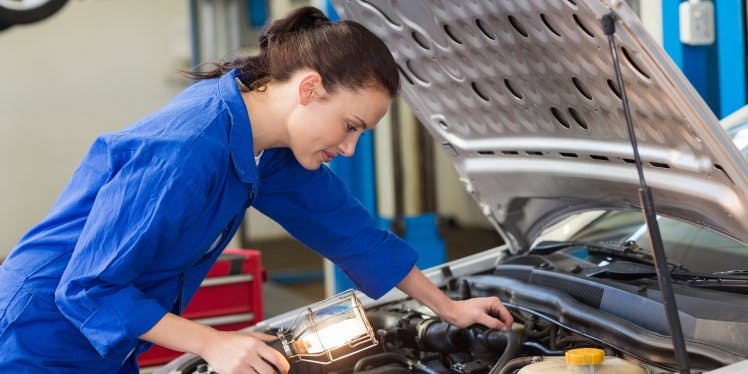 woman-working-on-a-car-engine