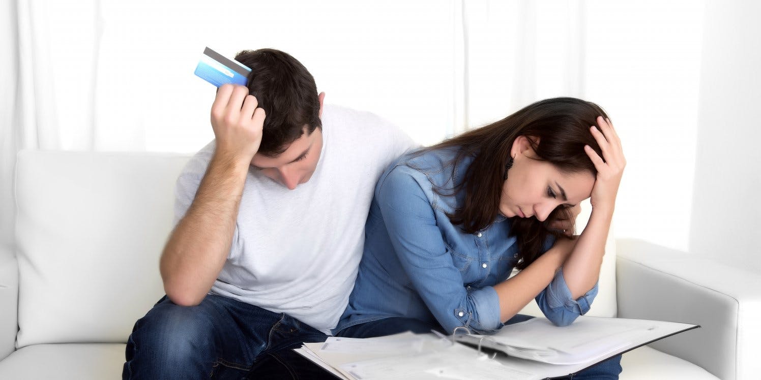 Stressed couple looking at finances