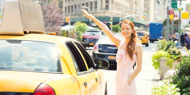 woman-in-united-states-of-america-with-yellow-taxi.CDN5e66117f