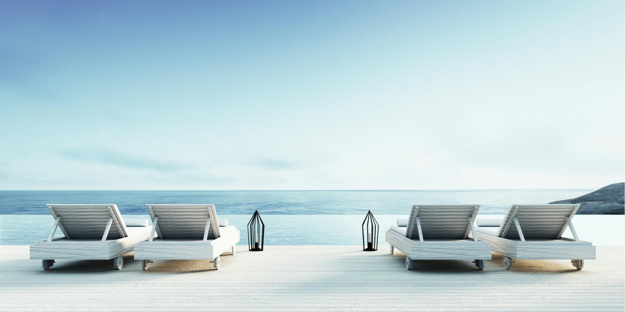 Beach lounge, 4 sun loungers at the edge of a pool and beach