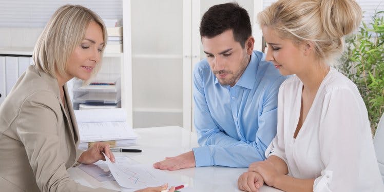 couple-in-office-getting-financial-advice