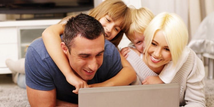 happy-family-looking-at-a-laptop