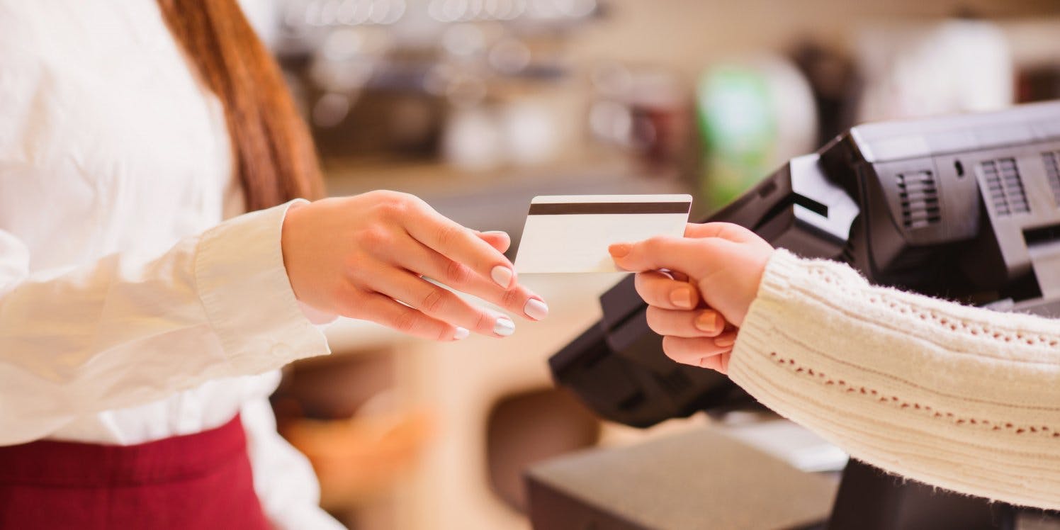 woman-handing-over-credit-card