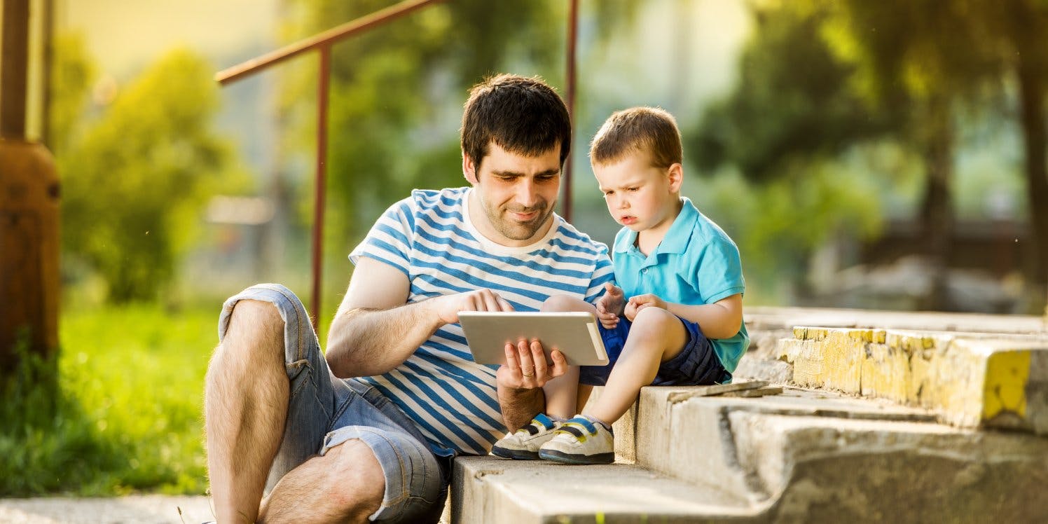 father-and-son-on-ipads